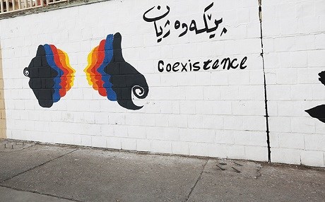 A wall in the city of Sulaimani, Kurdistan Region, displays art and a message of co-existence. File photo: Rudaw