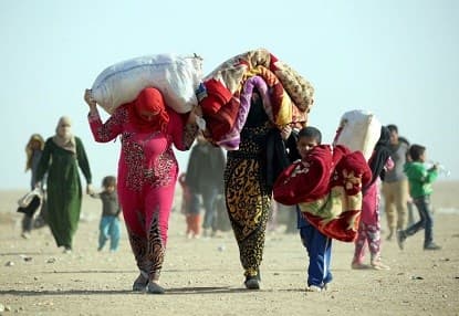 Two women from Mosul inside al-Hol refugee camp in Syria's al-Hasakah. AFP photo