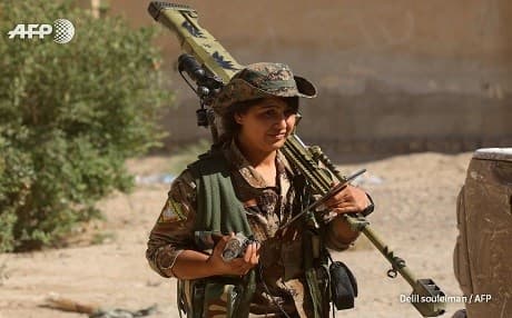 A member of the Kurdish women’s force YPJ in al-Sinaa, east Raqqa on Wednesday. Photo: Delil Souleiman/AFP