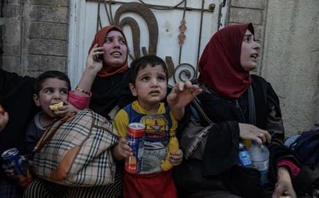 Civilians in west Mosul after an ISIS suicide bomber blew himself up among them, killing many, last week. Photo: Mohamed El-Shahed/AFP