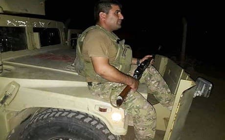 A Peshmerga fighter in the frontline against the ISIS group south of Kirkuk. Photo: HO