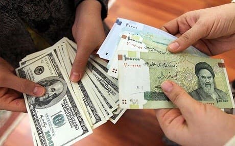 File photo of people counting money at a currency exchange in Tehran, Iran. Photo: AFP via Getty