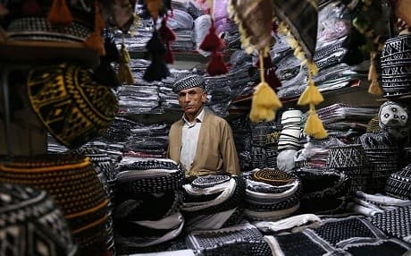 Kurdish man sells traditional Kurdish hats in Erbil. File Photo: AFP/Safin Hamid