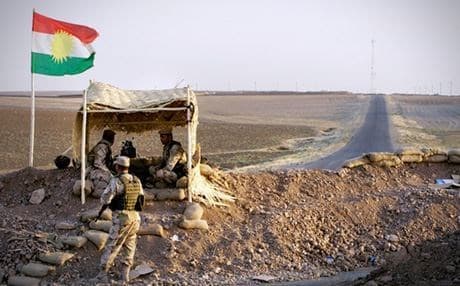 Forces from the ranks of the Kurdish Peshmerga man a defensive position. Photo: Rudaw