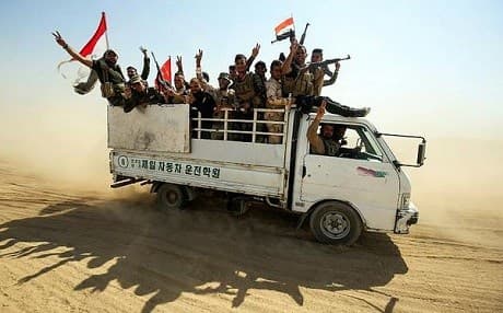 Hashd al-Shaabi advance near Sharqat on Friday. Photo: AFP