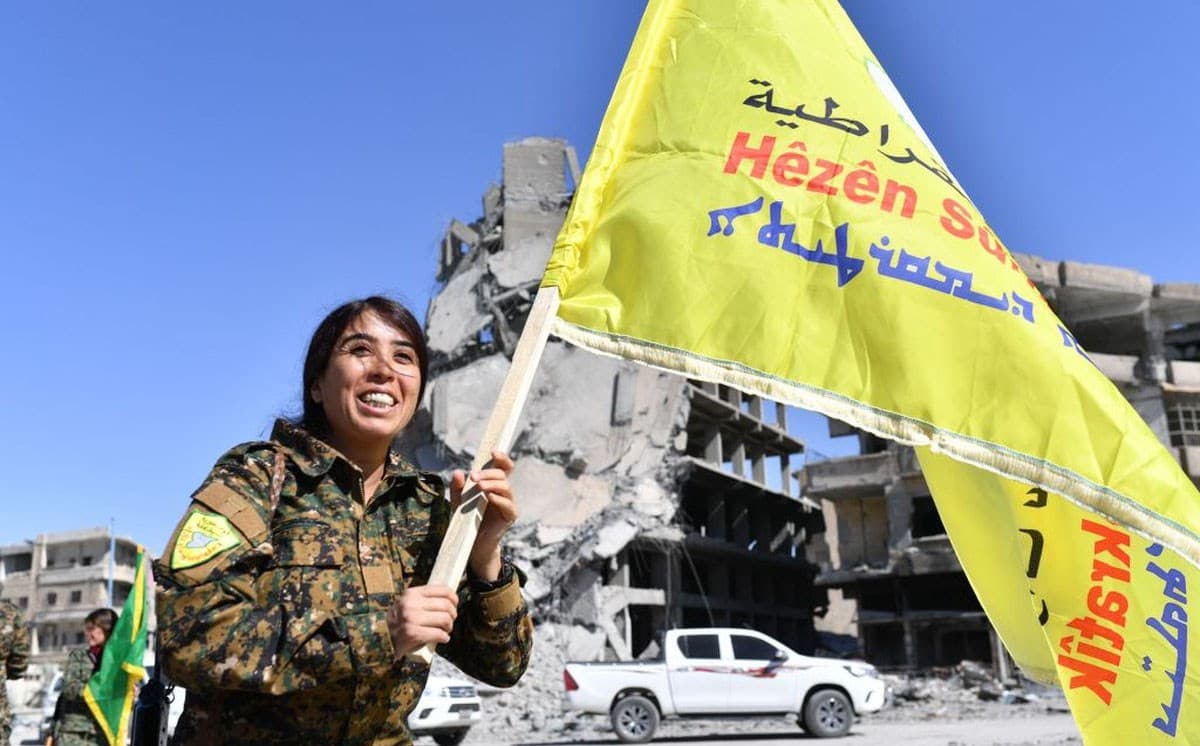 SDF Commander Rojda Felat celebrates victory over ISIS in central Raqqa on Tuesday. The SDF held a victory ceremony in the city on Friday. Photo: Bulent Kilic/AFP