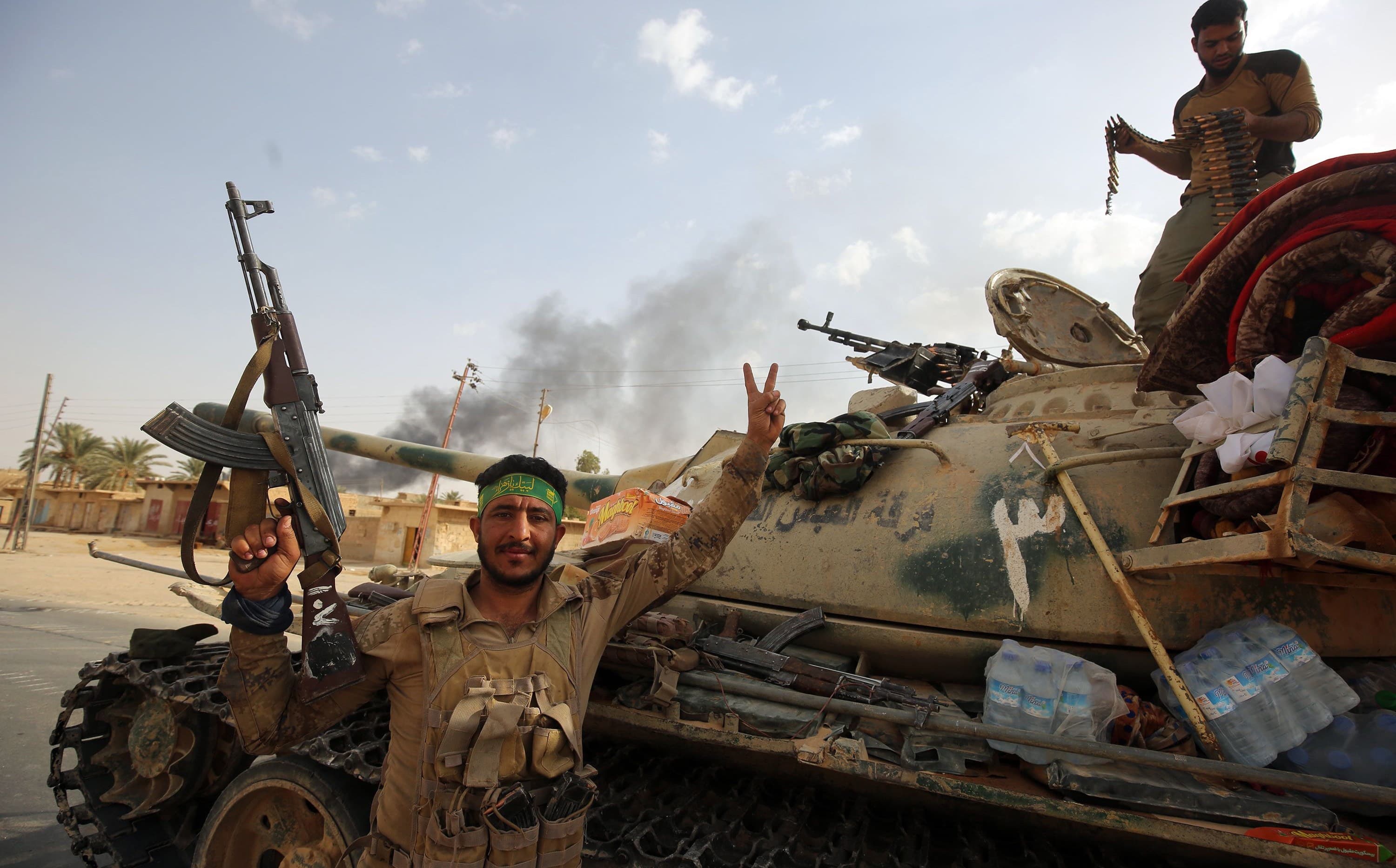 Hashd al-Shaabi members in al-Qaim on the Iraq-Syria border on Friday. Photo: Ahmad al-Rubaye/AFP