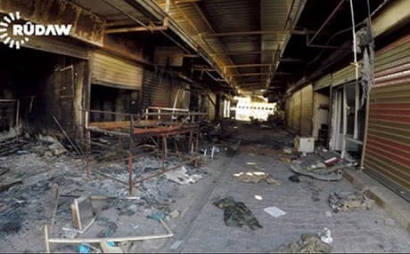 Inside Tuz Khurmatu: Buildings of Kurdish parties have been burned or bombed, or turned into a base for Iraqi forces. Photo: Rudaw