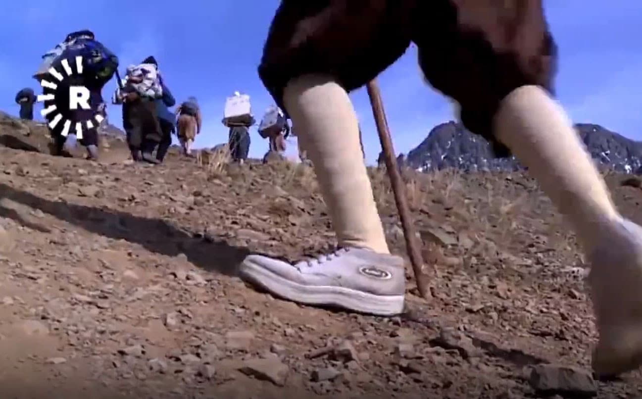 Kolbars carry their loads over the mountains on the Kurdistan Region-Iran border. Photo: Rudaw video