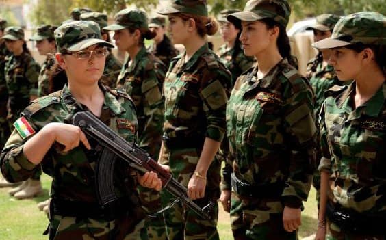 Yezidi women during military training. Women like these were part of the inspiration for Husson’s new file ‘Girls of the Sun.’ Photo: Getty