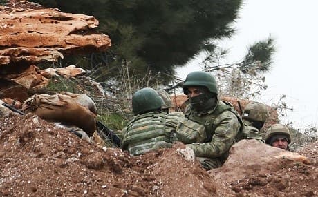 Turkish soldiers are seen around the area of Mount Bersaya, north of the Syrian town of Azaz near the border with Turkey, on January 22, 2018. Photo:AFP/Saleh Abo Ghaloun