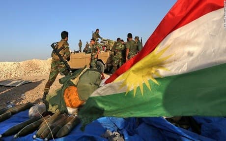 Kurdish Peshmerga load artillery into a launcher during the ISIS war. Photo: Safin Ahmed | AFP