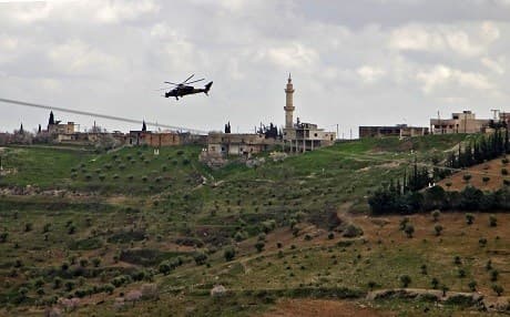 A Turkish army T129 ATAK attack helicopter flies toward the village of Al-Maabatli in the Afrin region on March 2, 2018. Photo: Bakr al-Kasem | AFP