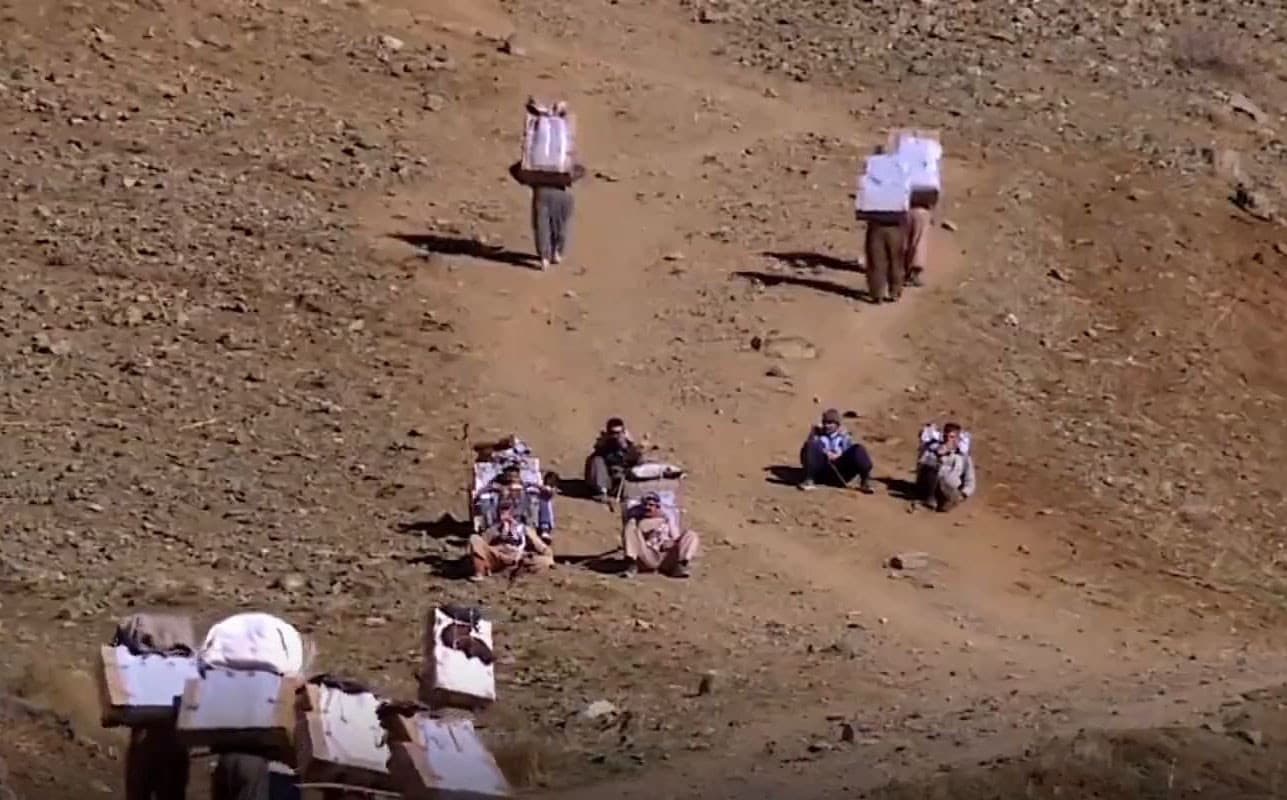 Kolbar are semi-legal cross-border porters carrying goods across the Kurdistan Region-Iran border. Photo: Rudaw TV