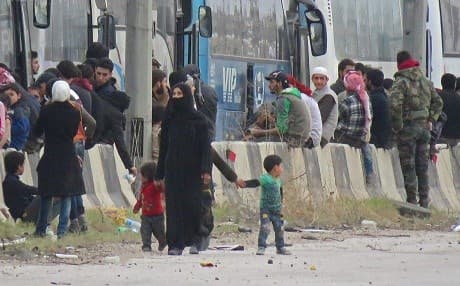 Hundreds of fighters and civilians from Harasta, Eastern Ghouta board buses on Friday in an evacuation deal. Photo: AFP