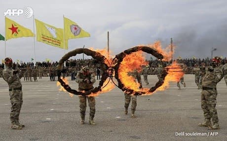Members of the Self-Defence Forces take part in a graduation ceremony in the Qamishli area last month. Photo: Delil Souleiman/AFP
