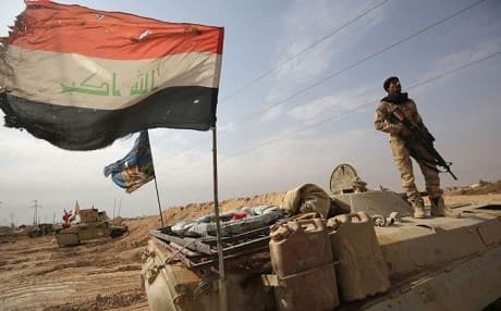 Iraqi forces are pictured near the Anbar border with Syria last November, after recapturing the town of Qaim from ISIS. Photo: Ahmad al-Rubaye/AFP/Getty Images