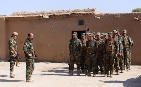 A Kakai commander 48, gives order to his troops Kirkuk province on August 18. Nezar is commander of the First Kakai Battalion of the Kurdish Peshmerga. Photo by Farzin Hasan/Rudaw/File