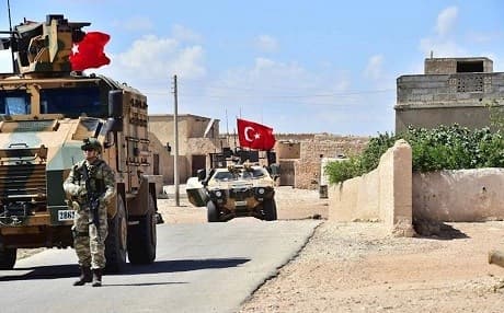 Turkish soldiers accompanied by armoured vehicles patrolling territory between the city of Manbij and the so-called Euphrates Shield region it controls. Photo: Turkish Armed Forces/handout via AFP