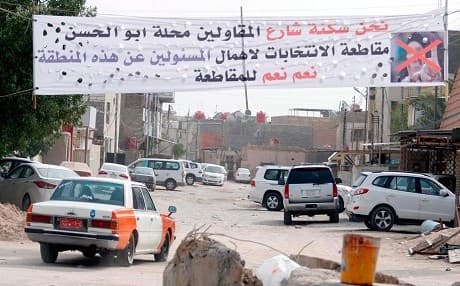 A banner calls for voters to boycott Iraq's parliamentary election in the southern city of Basra on May 8, 2018 when locals felt neglected by the federal government. File photo: AFP