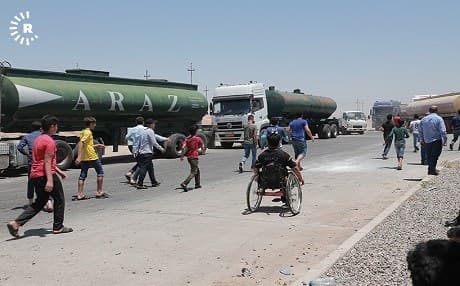 People in Kalak, Kurdistan Region, halt traffic on July 7, 2018, to protest electricity shortages. Photo: Mohammed Shwani | AFP