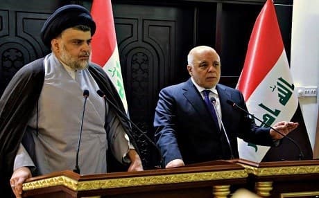 Iraqi Prime Minister Haider al-Abadi (right) and Shiite cleric Muqtada al-Sadr. File photo: AFP