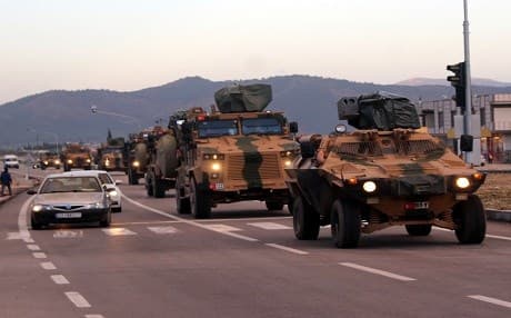 A convoy of Turkish military vehicles travels toward the Syrian border in southern Turkey on December 12, 2018. Photo: AA