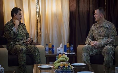 SDF Cmdr. Gen. Mazloum Kobani (left) shows various operational points on a map to Lt. Gen. Paul E. Funk, commander of CJTF-OIR, during a meeting near Ain Issa, Syria, on August 21, 2018. Photo: Staff Sgt. Brigitte Morgan | US Army