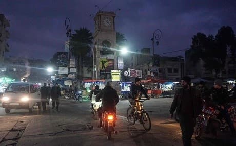 Vehicles, bicyles and mopeds are seen moving along a busy street in the northern city of Idlib, Syria's mostly rebel-held province on January 10, 2019. Photo: Muhammad Haj Kadour/AFP