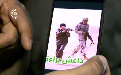 Rescued Yezidi child appears in ISIS propaganda training to fire a machine gun. Photo: Rudaw video