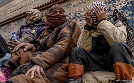 Men suspected of being Islamic State (IS) wait to be searched by members of the Kurdish-led Syrian Democratic Forces (SDF) after leaving the IS group's last holdout of Baghouz, in Syria's northern Deir Ezzor province, February 27, 2019. Photo: Bulent Kilic / AFP