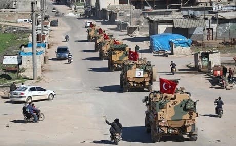 A column of armoured Turkish military vehicles drives on a patrol along a road in the de-militarised zone in Syria's northern Idlib province near the town Saraqib on March 8, 2019. File photo: Omar Haj Kadour | AFP