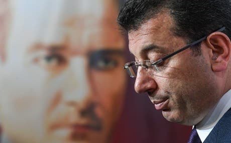 CHP candidate, Ekrem Imamoglu, who claimed victory as Istanbul mayor, speaks in front of a poster depicting the founder of modern Turkey Mustafa Kemal Ataturk, during a press conference at the CHP's Election Coordination Centre in Istanbul on April 3, 2019. Photo: Ozan Kose/AFP