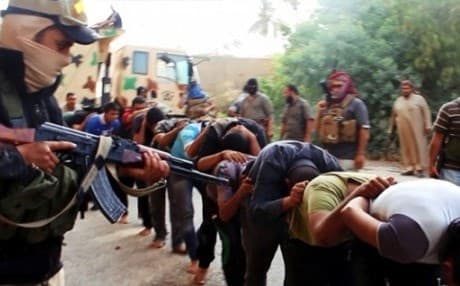 A photo from a jihadi website shows ISIS capturing Iraqi soldiers. AP file photo.
