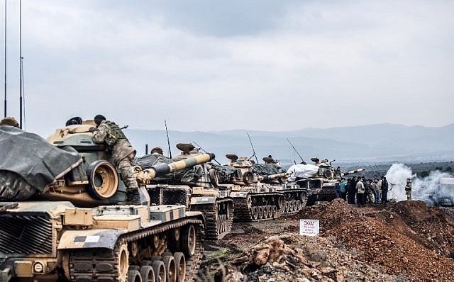 Turkish troops gather at the border with Afrin in January. Photo: Bulent Kilic/AFP