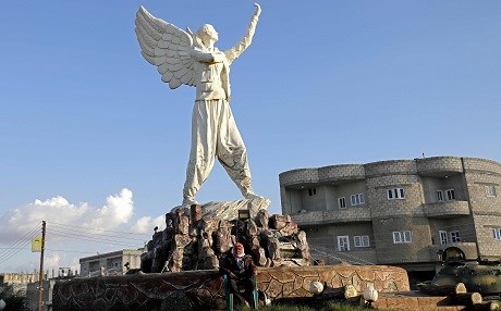 The Free Woman statue stands over Kobane. Photo: Delil Souleiman / AFP