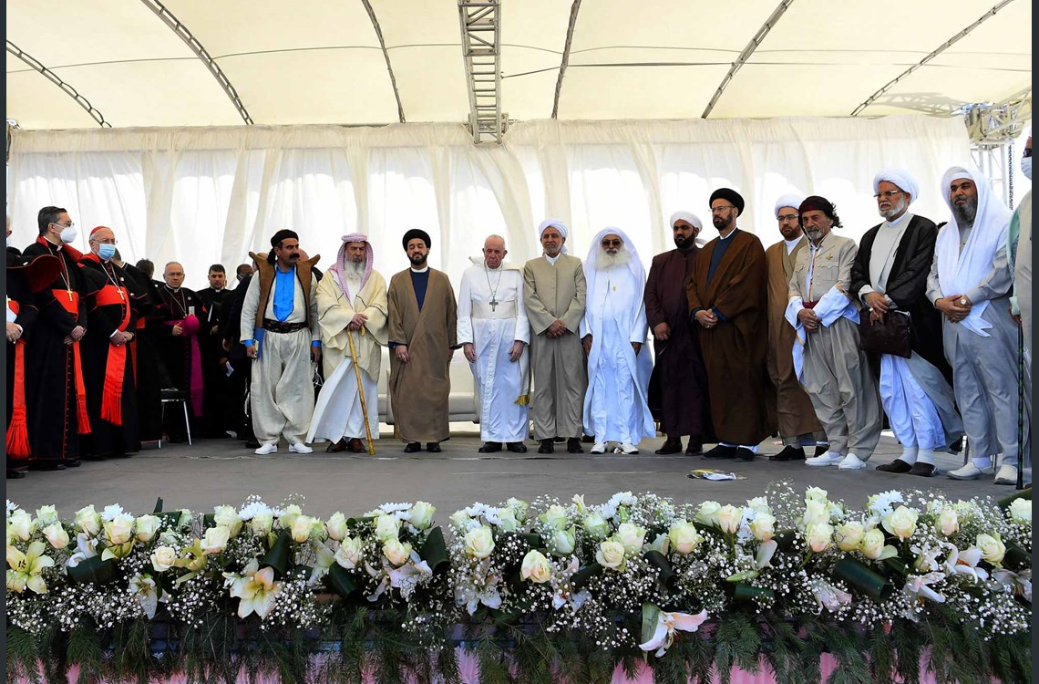 A handout picture released by the Vatican media office shows Pope Francis standing with Iraqi religious figures during an interfaith service at the House of Abraham in the ancient city of Ur in southern Iraq's Dhi Qar province, on March 6, 2021. Photo: VATICAN MEDIA / AFP