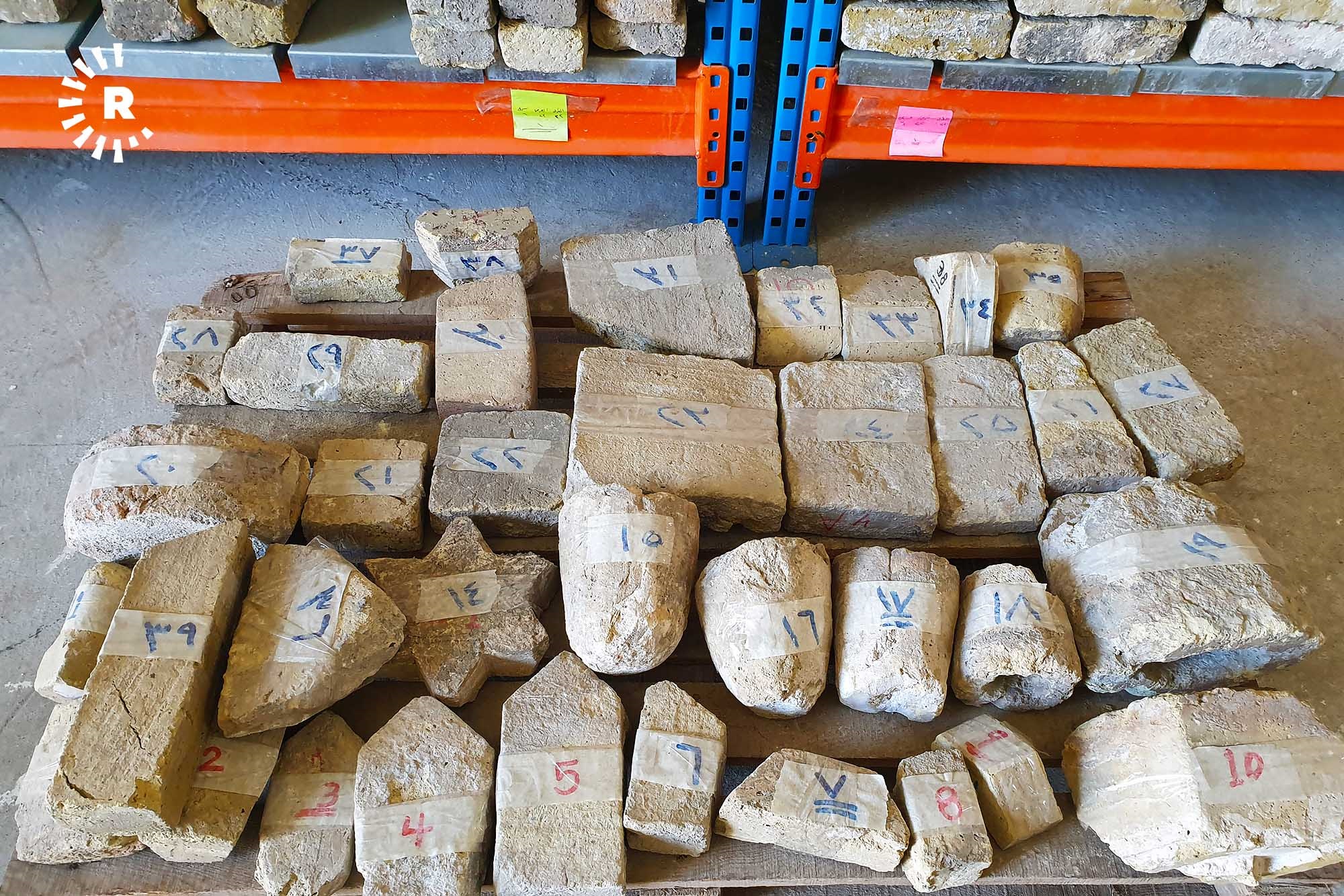 Thirty-nine stones of different shapes and sizes from the original mosque and minaret are stored at the al-Nuri Mosque complex warehouse, as seen in this photo from February 23, 2021, to be used as models for reconstruction. Each is more than 800 years old. Photo: Khazan Jangiz / Rudaw