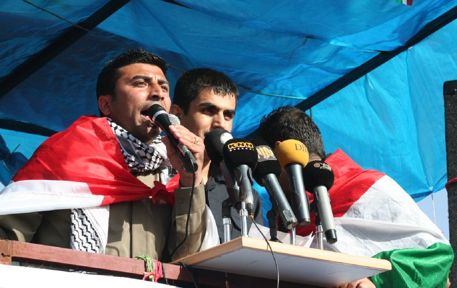Ismail Abdullah speaks from a podium during demonstrations in Sulaimani in February 2011. Photo: Zmnako Ismael
