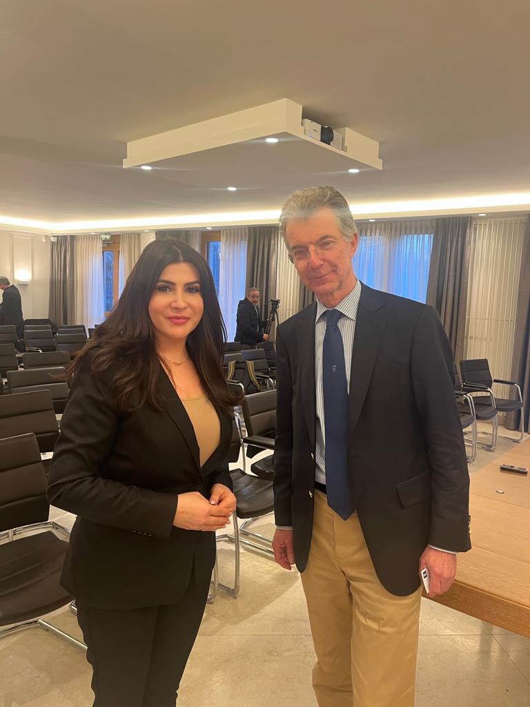 ئاڵا شاڵی، پەیامنێری رووداو لەگەڵ د. کریستۆف هیوسگن، سەرۆکی نوێی کۆنفرانسی ئاسایشی میونشن