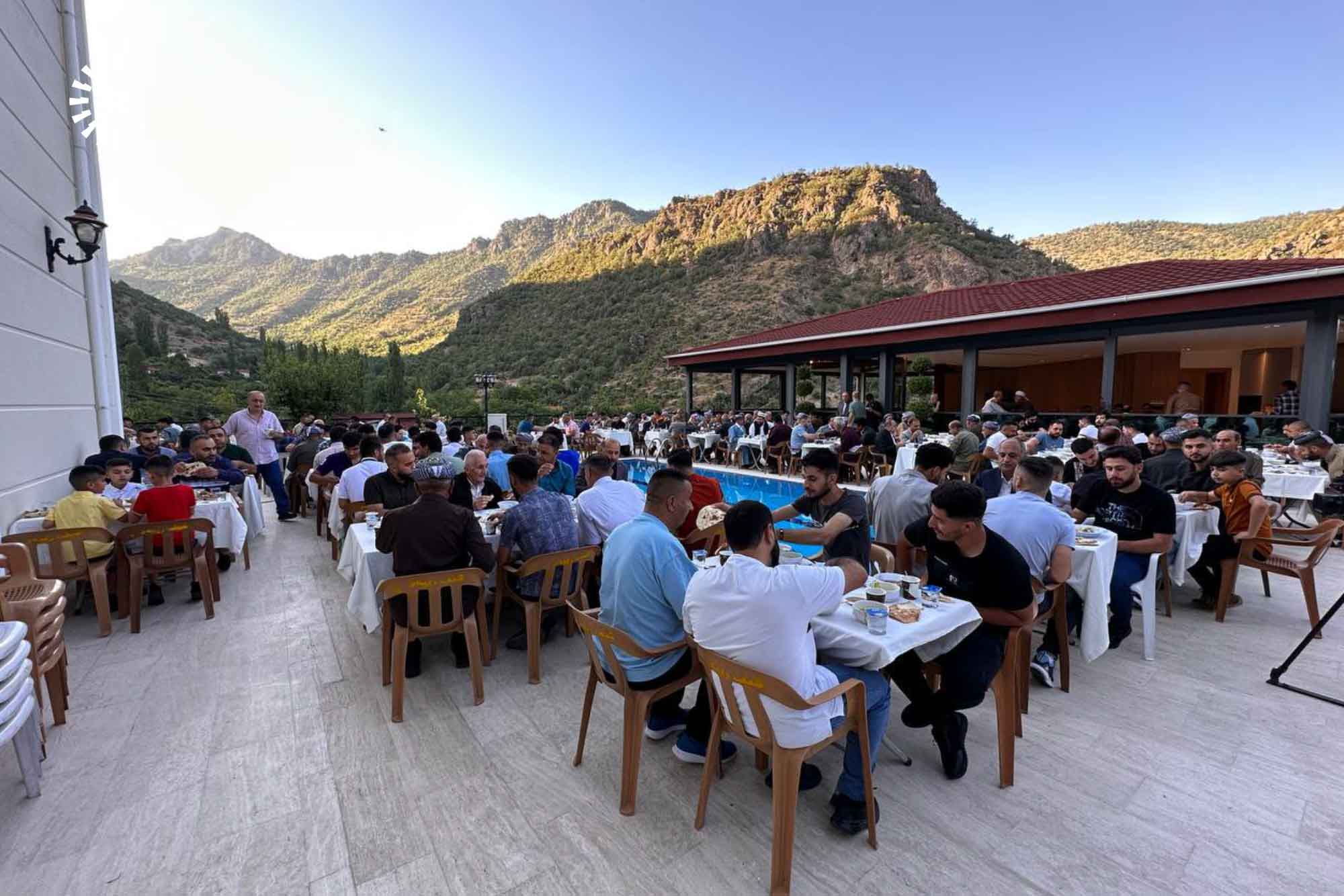 Hirore residents have lunch together during Eid al-Adha feast on June 28, 2023. Photo: summitted