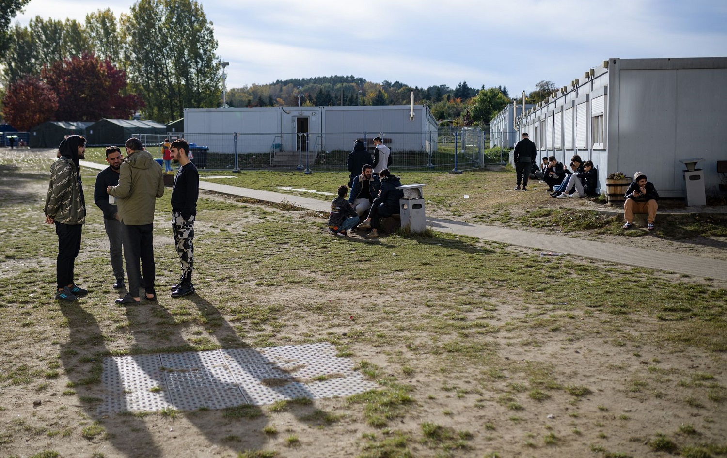 Refugees are seen on the grounds of the arrival centre of the initial reception facility of the eastern Germany on October 25, 2021. Photo: Jens Schlueter/AFP
