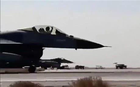 AP File Photo: Jordanian air force pilot raises his arm as he taxis his jet at Mowafak Al-Salti airbase in Azraq, Jordan.