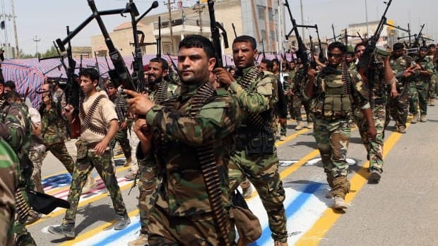 A Shiite militia marches in Baghdad 