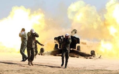 Pictured: Volunteer Shiite fighters, supporting the Iraqi government forces against ISIS near the city of Tikrit — AP.