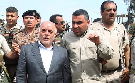 Iraqi PM Haider Abadi visiting government and militia forces in Tikrit following its liberation from ISIS in April, 2015. AFP file photo