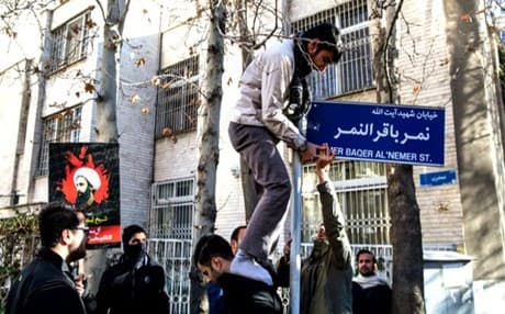Angry protesters installing a street sign named after Saudi Shiite cleric Sheikh Nimr al-Nimr. Photo: MEHR
