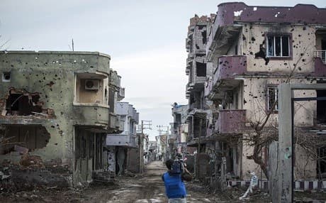 A cameraman films the destruction in Silopi. Rudaw photo.
