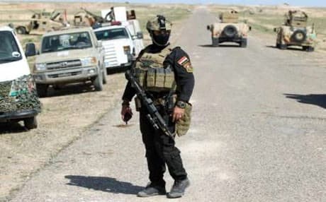 Iraqi soldiers at the frontline in the Anbar desert northeast of Hit earlier this month.  AP Photo.