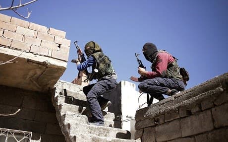 Kurdistan Workers' Party (PKK) members run as they attack Turkish security forces in Nusaydin, Turkey, Tuesday, March 1, 2016. AP Photo.